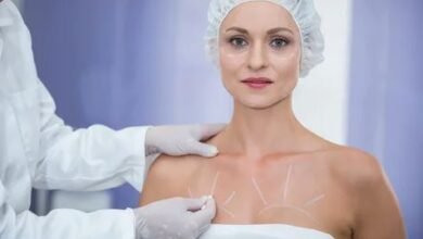 A woman undergoing breast surgery, preparing for her breast implant procedure in a clinical setting.