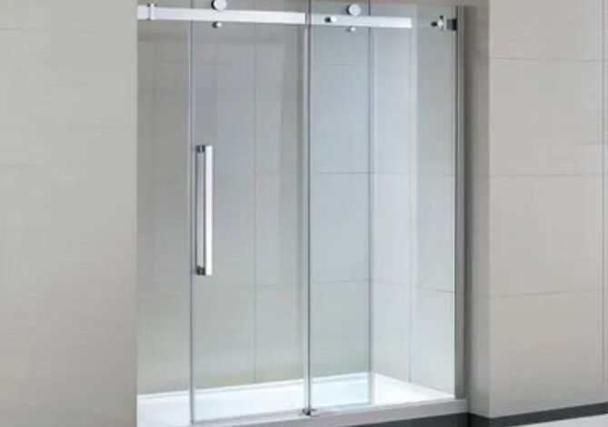 A sleek glass shower door featuring a modern sliding mechanism for easy access and a contemporary aesthetic.