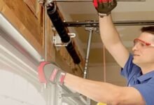 Garage door repair service in Maryland, showcasing a technician fixing a residential garage door.