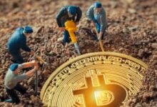 Miniature figures excavate dirt in search of a bitcoin, illustrating the concept of cryptocurrency mining.